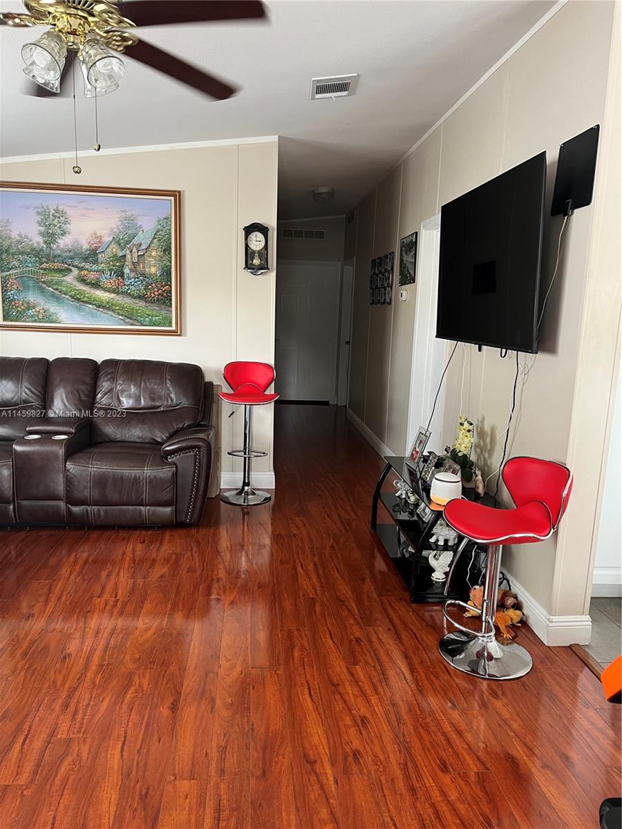 28501 Southwest 152nd Avenue Homestead, FL 33033 - Photo 9 of 32 a living room with furniture and a flat screen tv