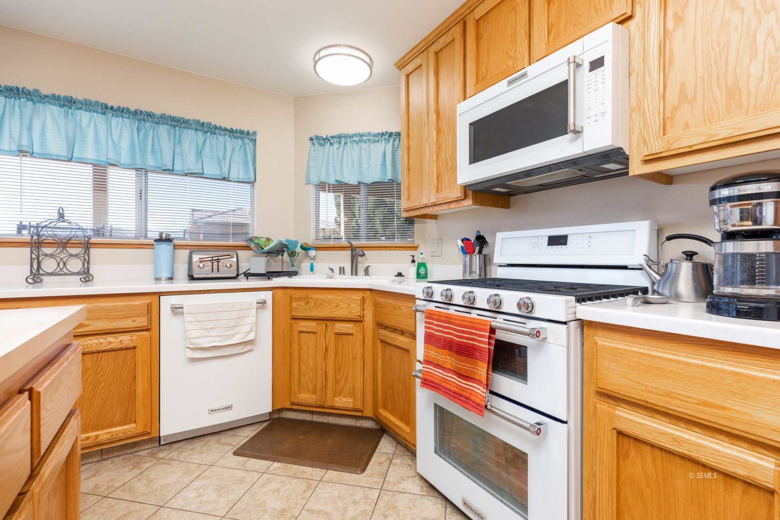 1047 Carolyn Street Ridgecrest, CA 93555 - Photo 10 of 35 a kitchen with stainless steel appliances granite countertop a sink and cabinets