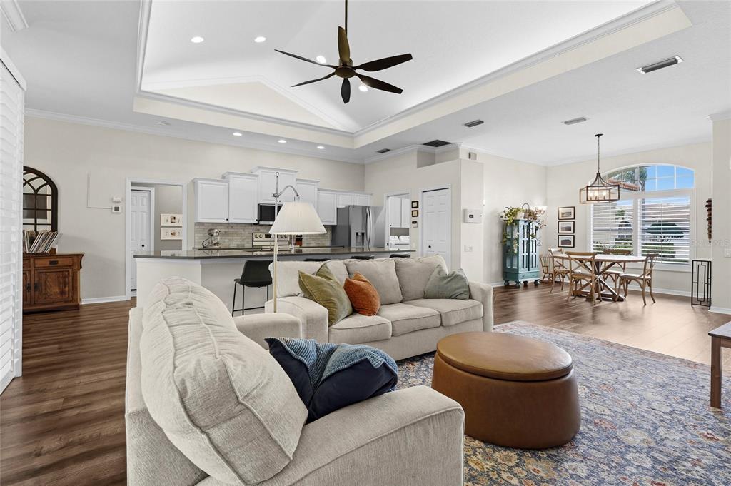 6582 Waters Edge Way Lakewood Ranch, FL 34202 - Photo 14 of 98 a living room with furniture and kitchen view