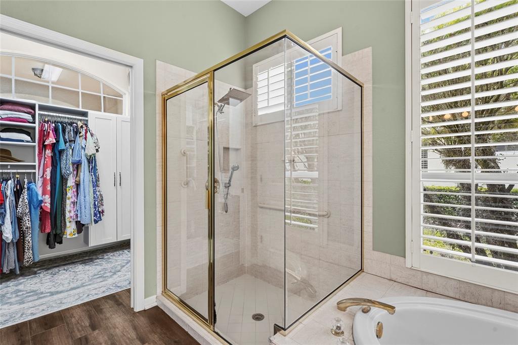 6582 Waters Edge Way Lakewood Ranch, FL 34202 - Photo 32 of 98 a view of a bathroom with a glass door