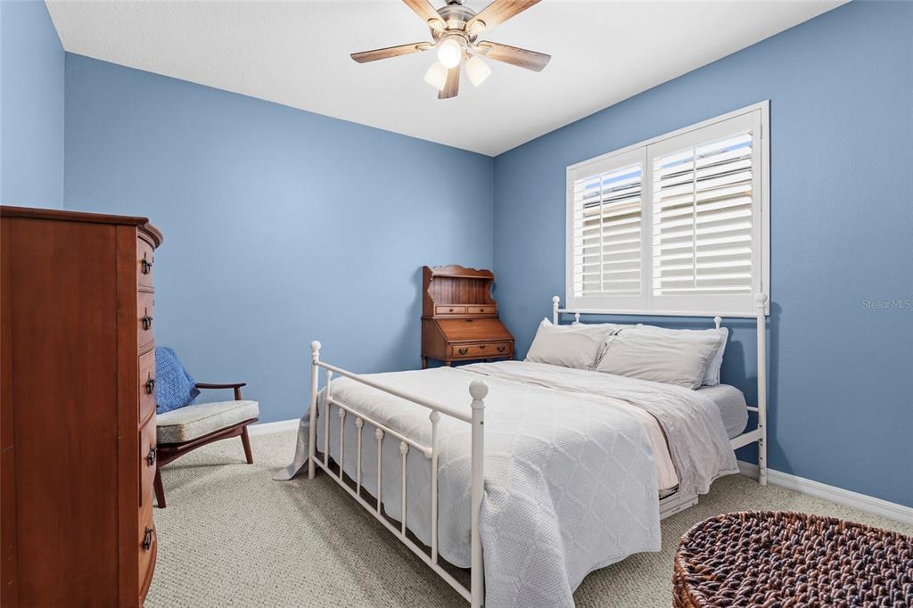6582 Waters Edge Way Lakewood Ranch, FL 34202 - Photo 38 of 98 a bedroom with a bed and window