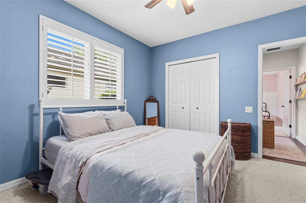 6582 Waters Edge Way Lakewood Ranch, FL 34202 - Photo 40 of 98 a bedroom with a large bed and a window