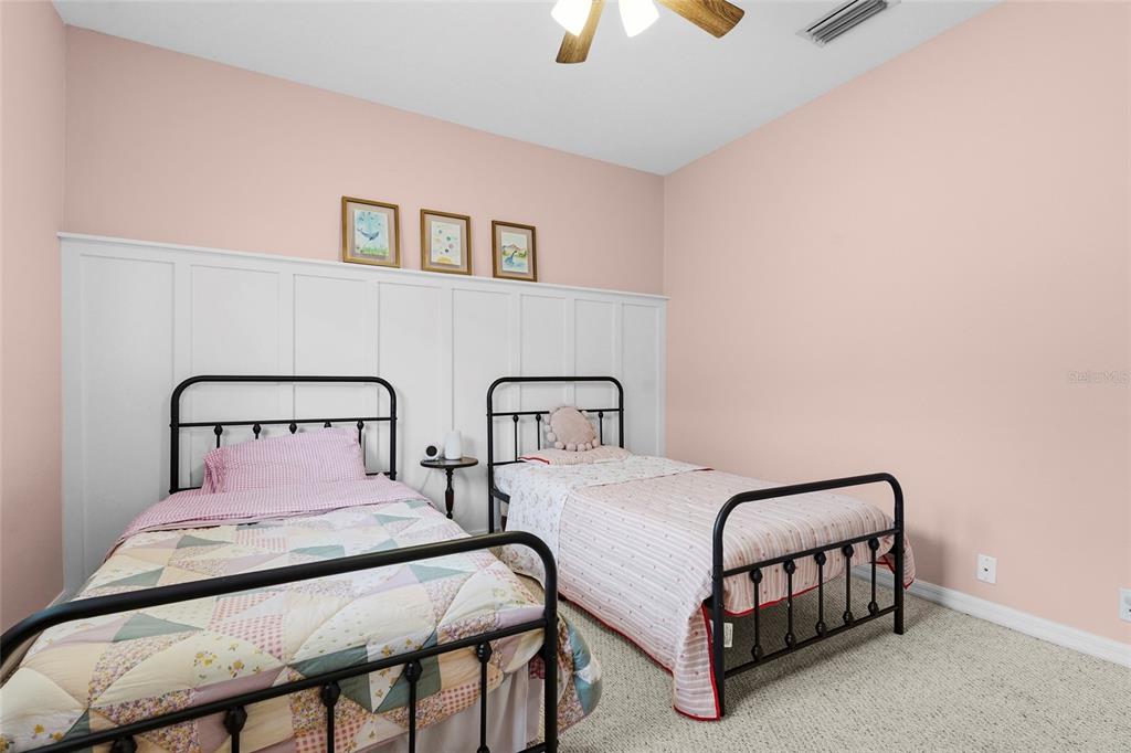 6582 Waters Edge Way Lakewood Ranch, FL 34202 - Photo 43 of 98 a bedroom with two beds and painting on the wall