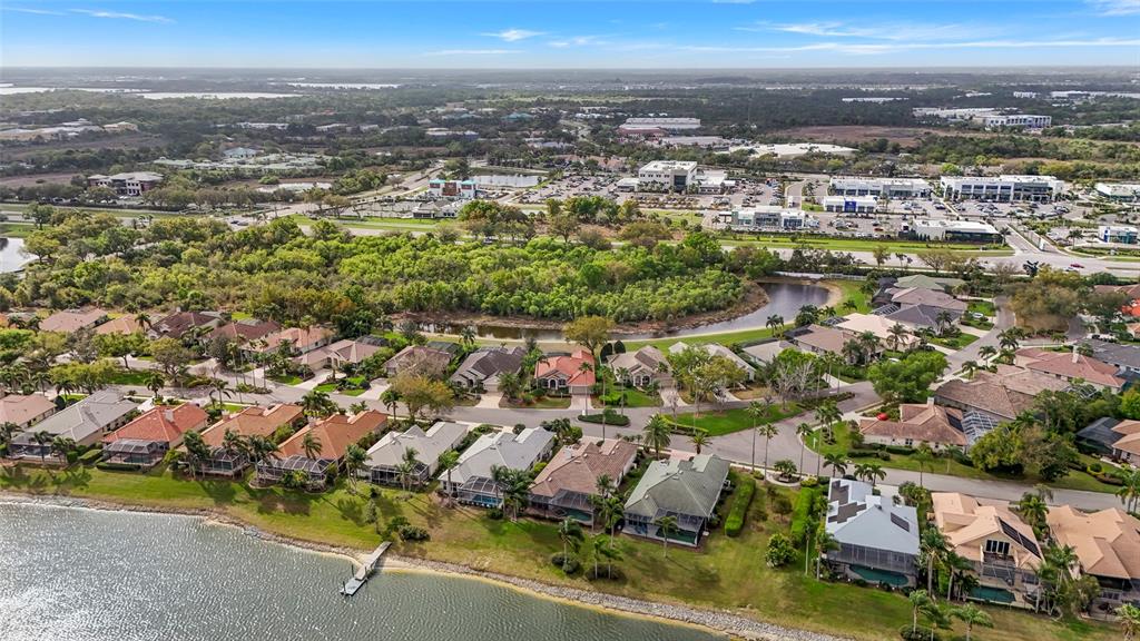 6582 Waters Edge Way Lakewood Ranch, FL 34202 - Photo 61 of 98 an aerial view of residential houses with outdoor space and ocean view