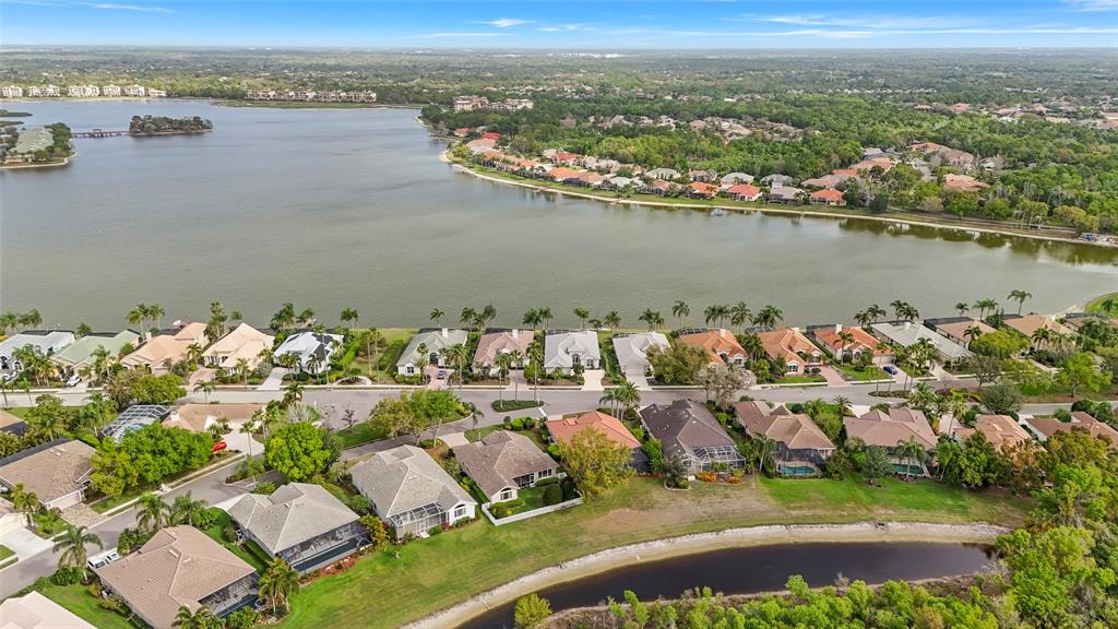 6582 Waters Edge Way Lakewood Ranch, FL 34202 - Photo 65 of 98 an aerial view of residential houses with outdoor space