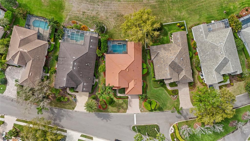 6582 Waters Edge Way Lakewood Ranch, FL 34202 - Photo 70 of 98 an aerial view of residential house with outdoor space