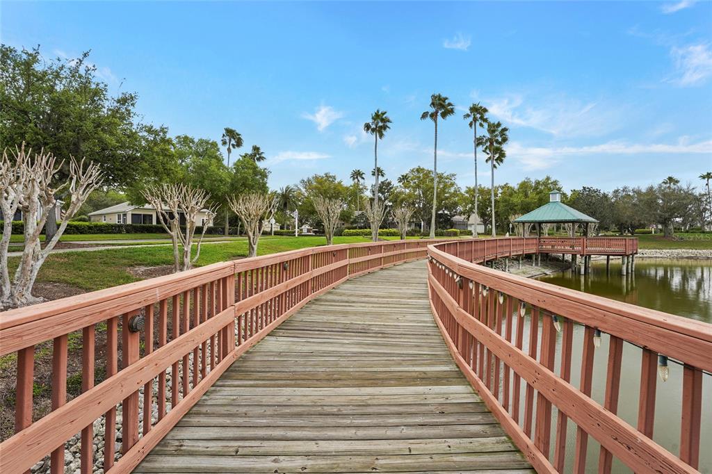 6582 Waters Edge Way Lakewood Ranch, FL 34202 - Photo 73 of 98 a view of a balcony with wooden stairs