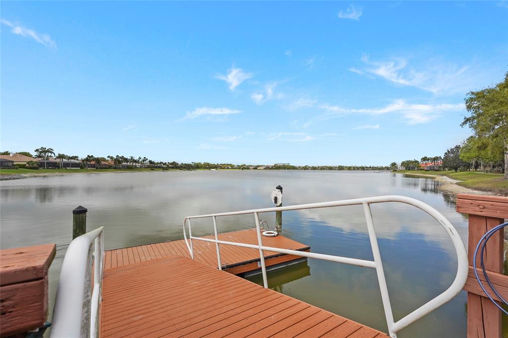 6582 Waters Edge Way Lakewood Ranch, FL 34202 - Photo 76 of 98 a view of a swimming pool with a lake view