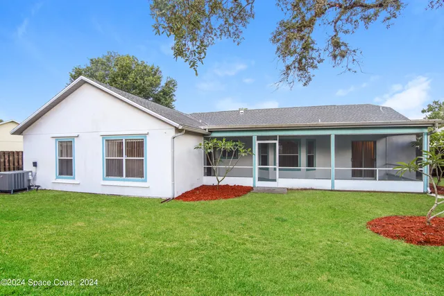 a view of a house with a yard and porch with a garden