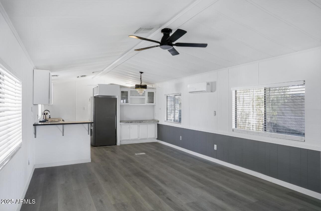 805 North Dysart Road, Unit 33 Avondale, AZ 85323 - Photo 13 of 18 a view of empty room with wooden floor and window
