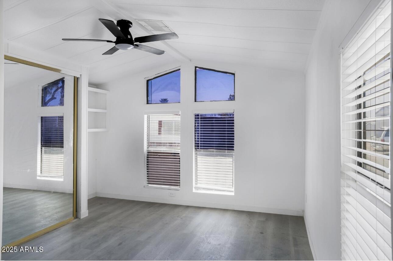 805 North Dysart Road, Unit 33 Avondale, AZ 85323 - Photo 15 of 18 a view of livingroom with hardwood floor and a ceiling fan