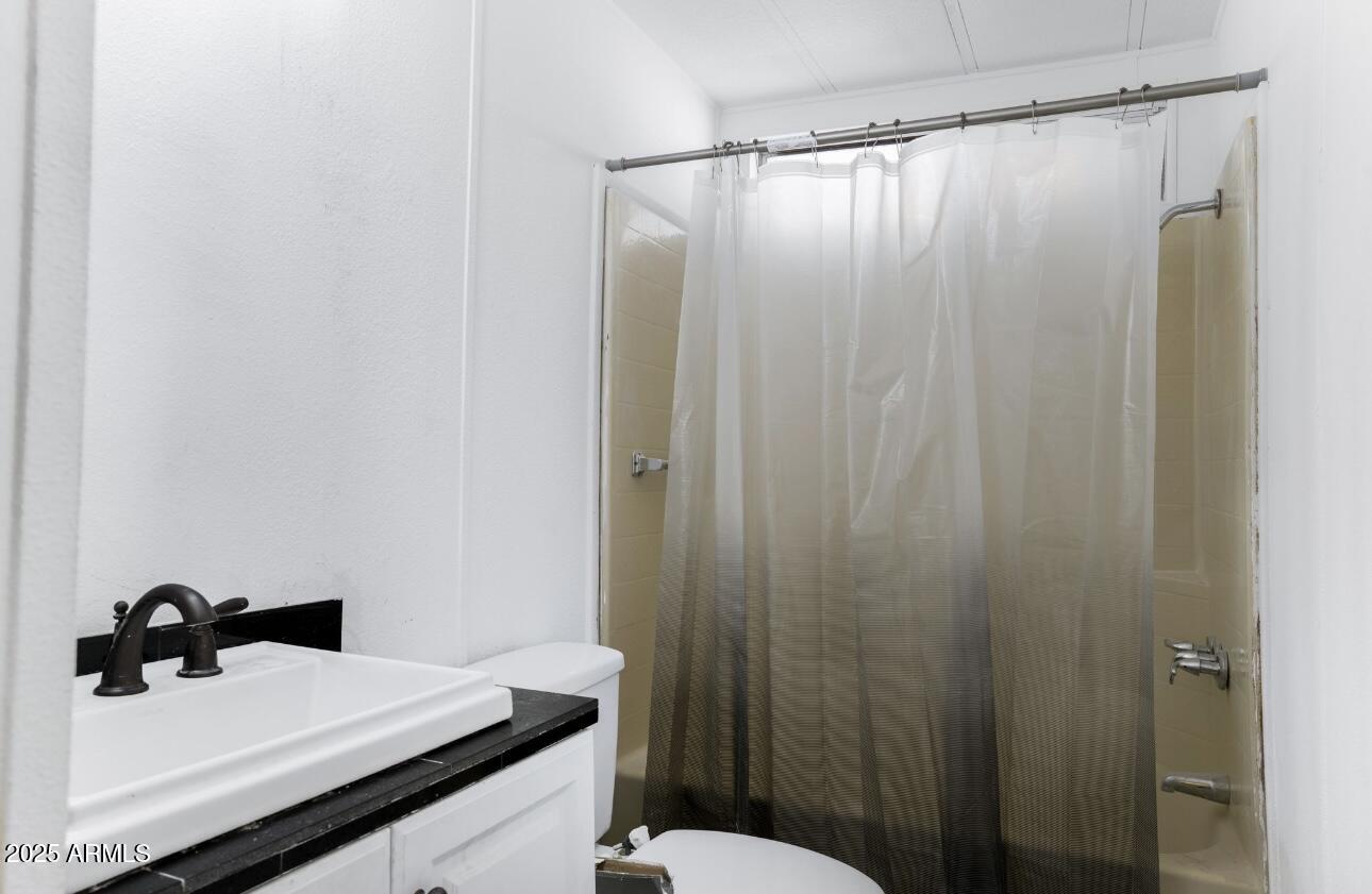 805 North Dysart Road, Unit 33 Avondale, AZ 85323 - Photo 7 of 18 a bathroom with a sink and a mirror