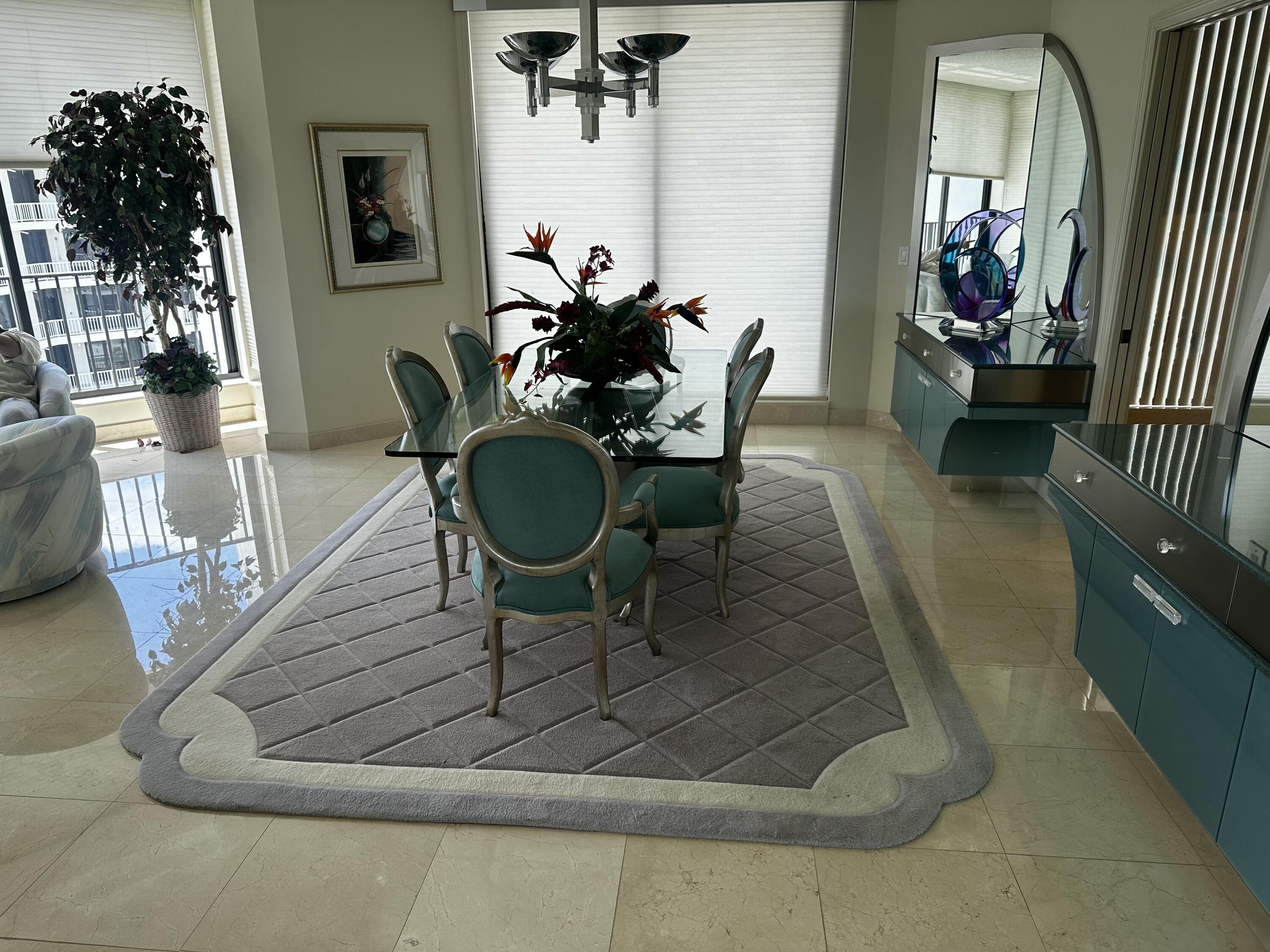 20320 Fairway Oaks Drive, Unit 373 Boca Raton, FL 33434 - Photo 13 of 27 a living room with furniture and a chandelier