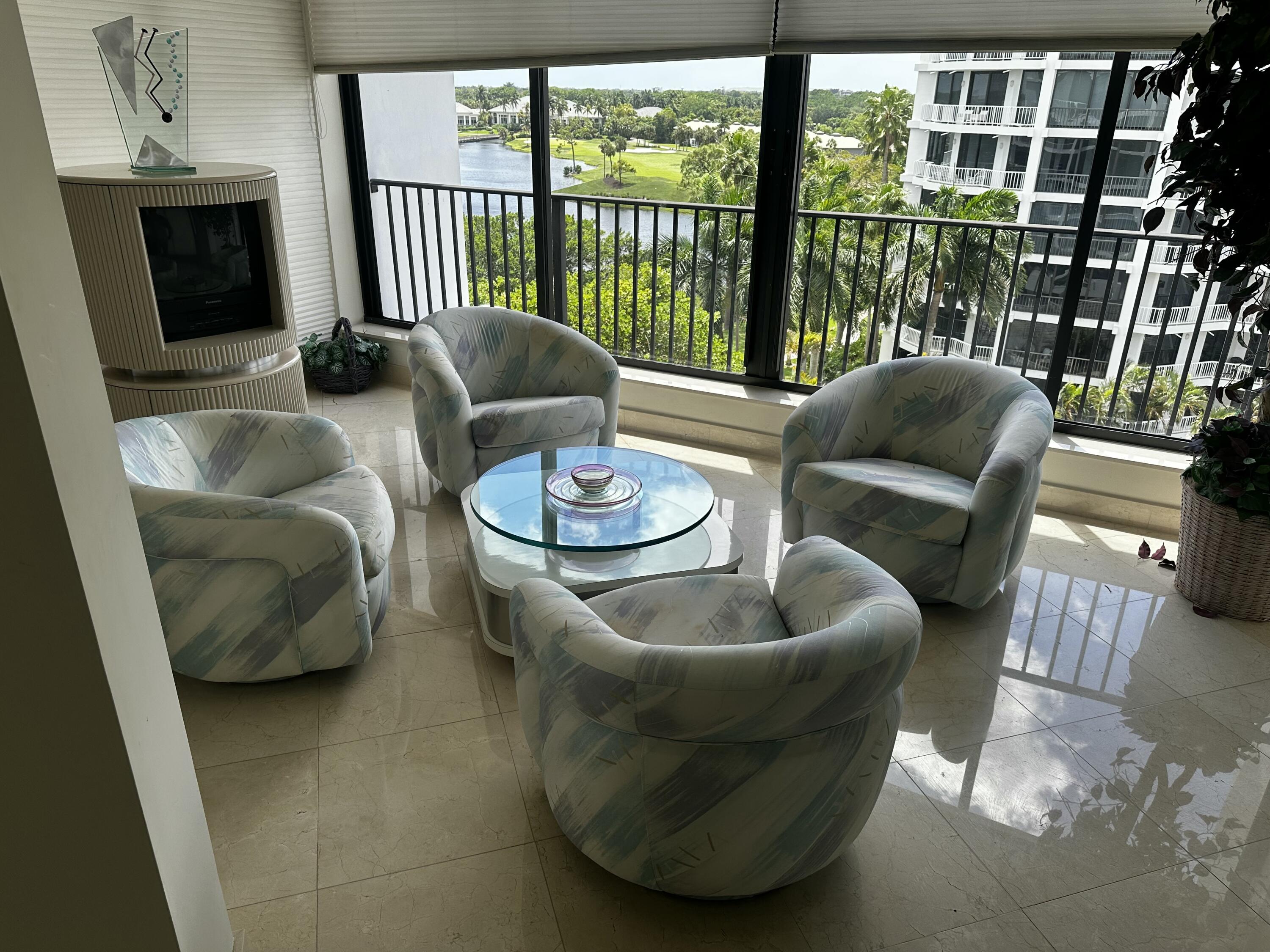 20320 Fairway Oaks Drive, Unit 373 Boca Raton, FL 33434 - Photo 14 of 27 a living room with furniture and a floor to ceiling window