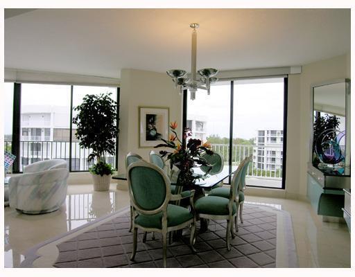20320 Fairway Oaks Drive, Unit 373 Boca Raton, FL 33434 - Photo 18 of 27 a view of a dining room with furniture window and wooden floor