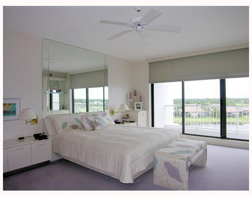 20320 Fairway Oaks Drive, Unit 373 Boca Raton, FL 33434 - Photo 19 of 27 a bedroom with a large bed and a large window