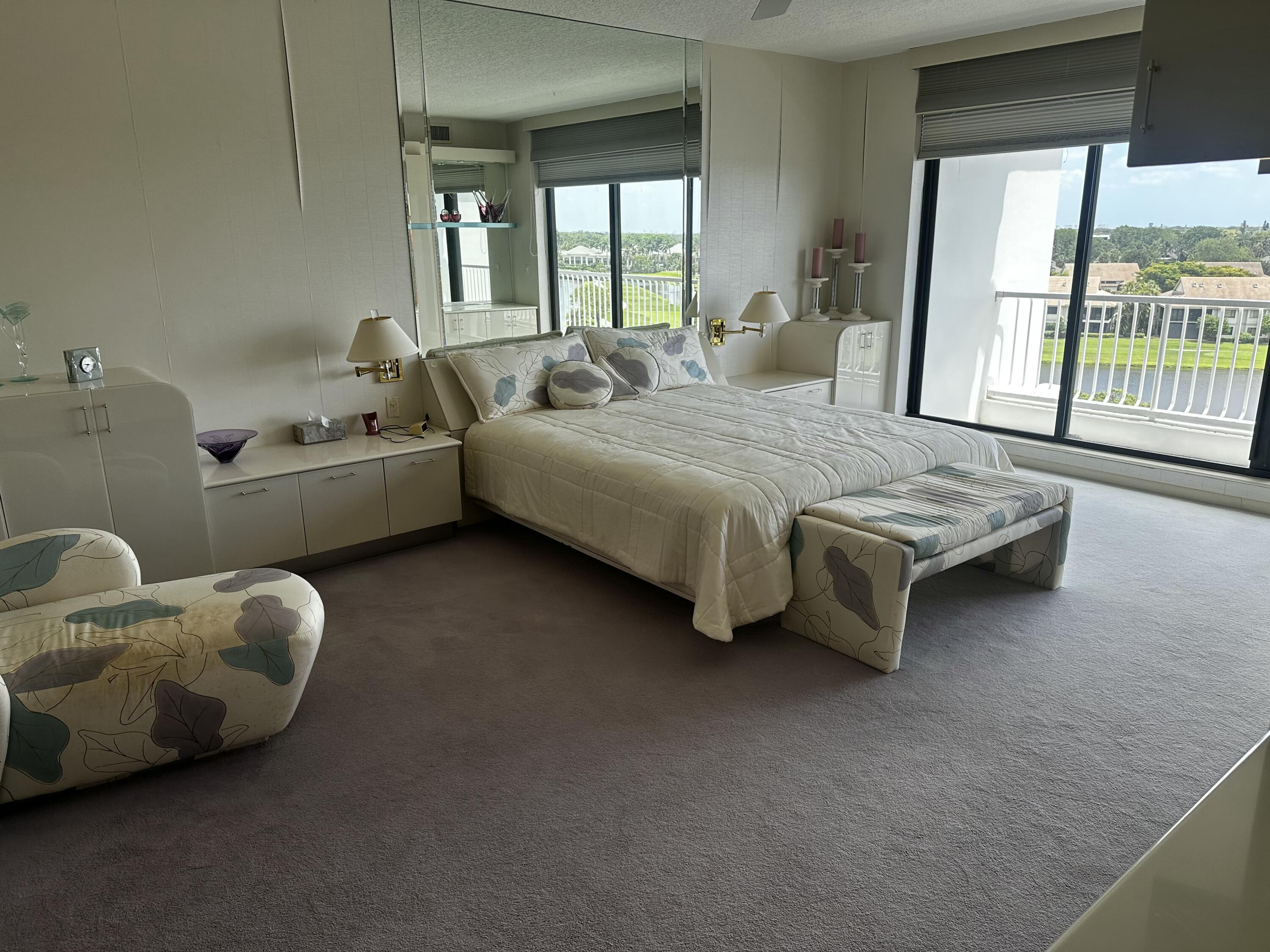 20320 Fairway Oaks Drive, Unit 373 Boca Raton, FL 33434 - Photo 20 of 27 a room with a bed and a couch