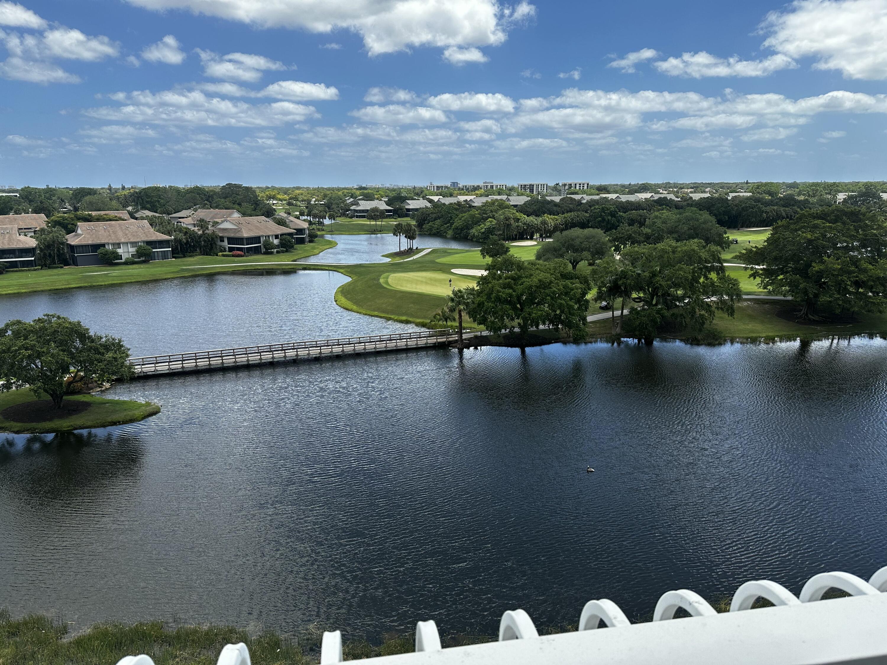 20320 Fairway Oaks Drive, Unit 373 Boca Raton, FL 33434 - Photo 2 of 27 a view of a lake with a mountain