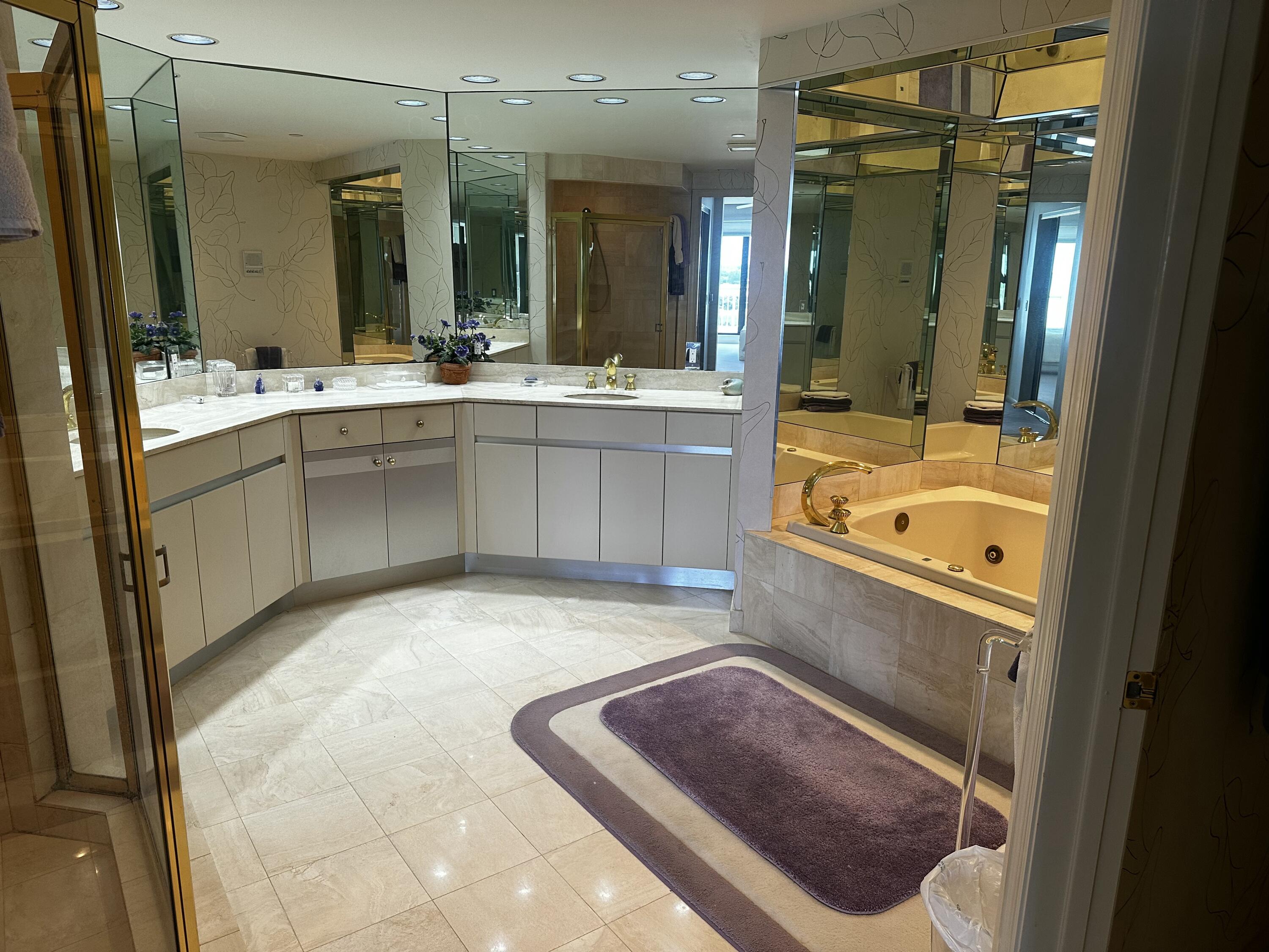 20320 Fairway Oaks Drive, Unit 373 Boca Raton, FL 33434 - Photo 27 of 27 a bathroom with a tub sink shower and mirror