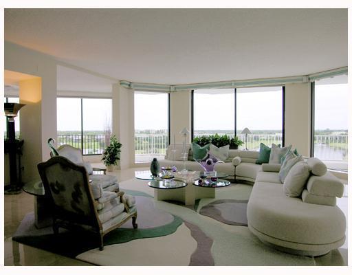 20320 Fairway Oaks Drive, Unit 373 Boca Raton, FL 33434 - Photo 5 of 27 a living room with furniture and floor to ceiling windows