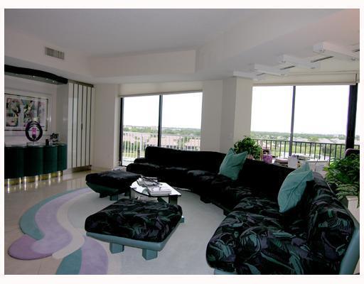 20320 Fairway Oaks Drive, Unit 373 Boca Raton, FL 33434 - Photo 9 of 27 a living room with furniture and a large window