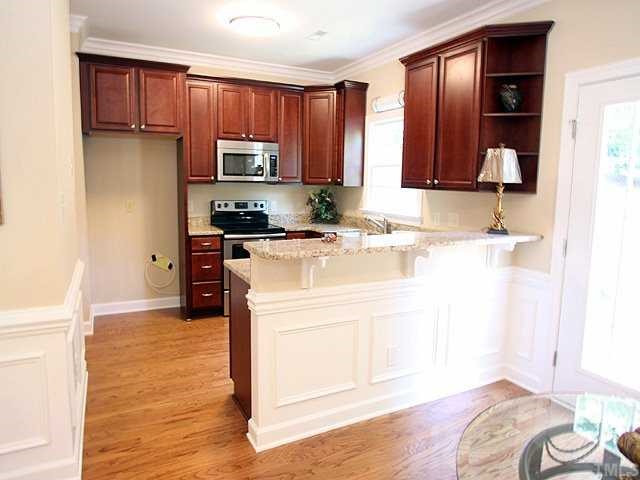 779 Weathergreen Drive Raleigh, NC 27615 - Photo 3 of 12 ALL NEW KITCHEN FEATURING 42" CHERRY CABINETS; STAINLESS STEEL APPLIANCES AND GRANITE COUNTETOPS