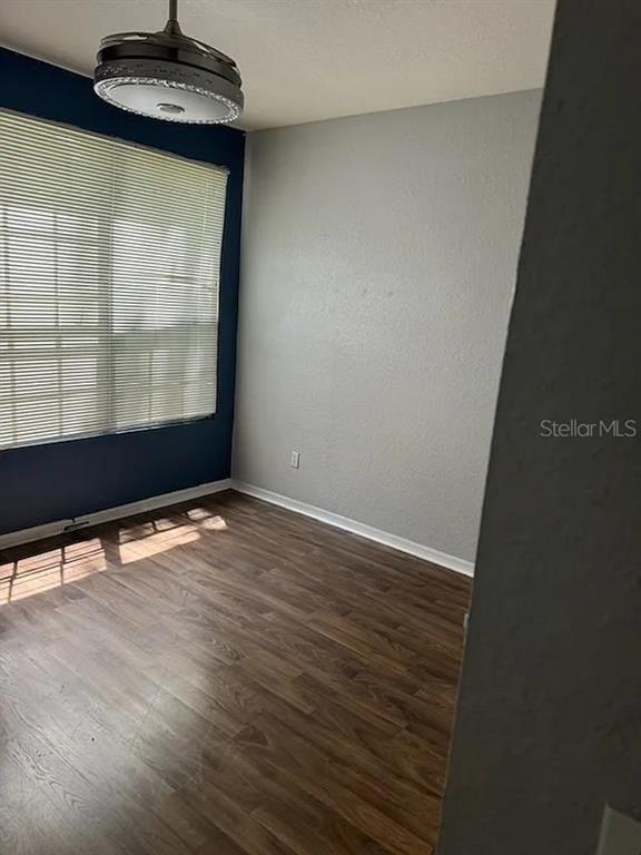 6392 Raleigh Street, Unit 2801 Orlando, FL 32835 - Photo 6 of 11 a view of a room with wooden floor and a window