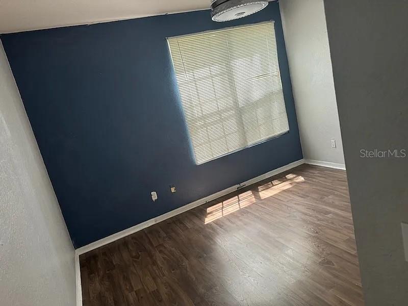 6392 Raleigh Street, Unit 2801 Orlando, FL 32835 - Photo 7 of 11 a view of an empty room and window