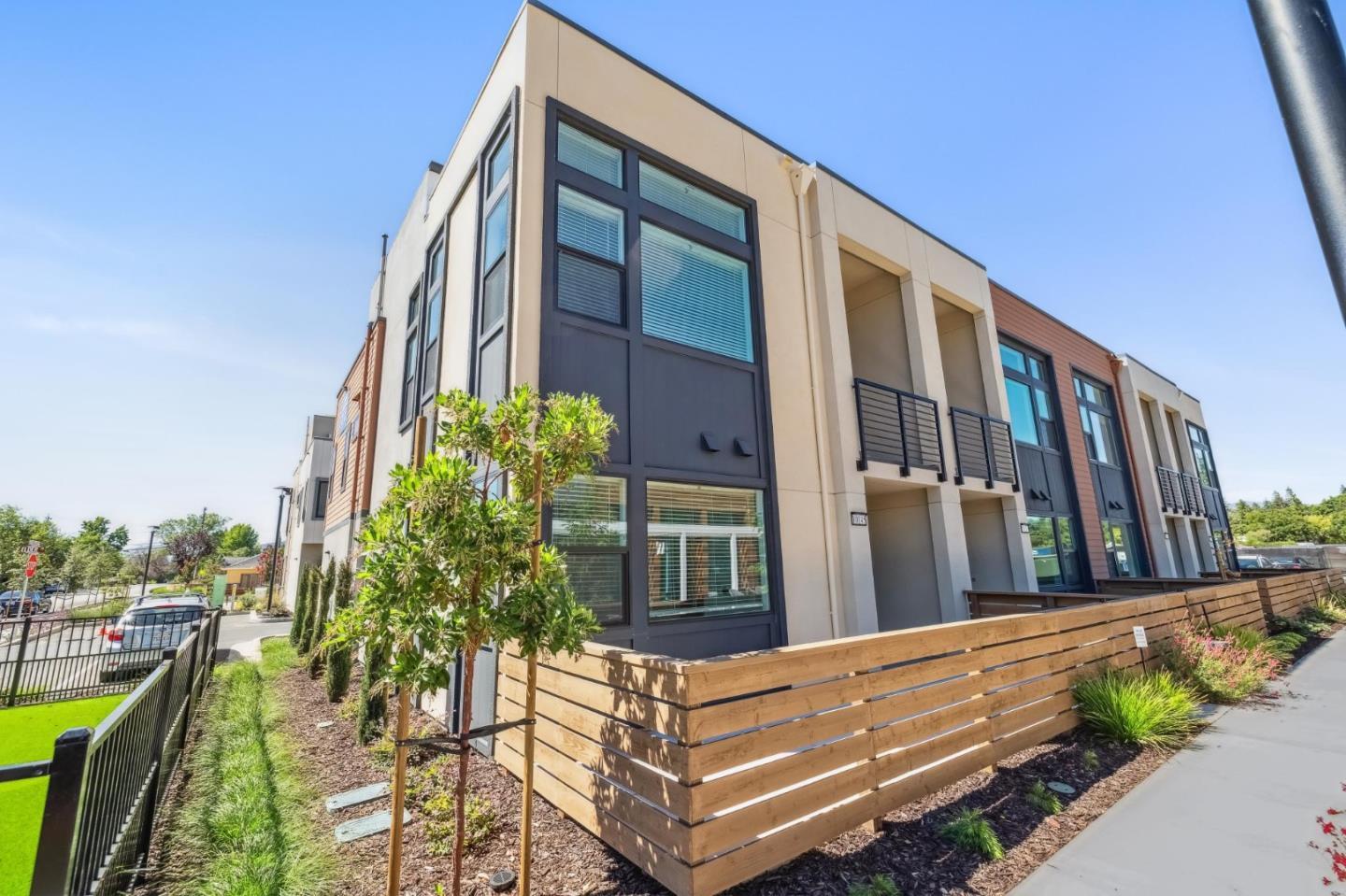 11155 Maple Place, Unit 3407 PLAN 3 Saratoga, CA 95070 - Photo 11 of 15 a view of a building from a balcony
