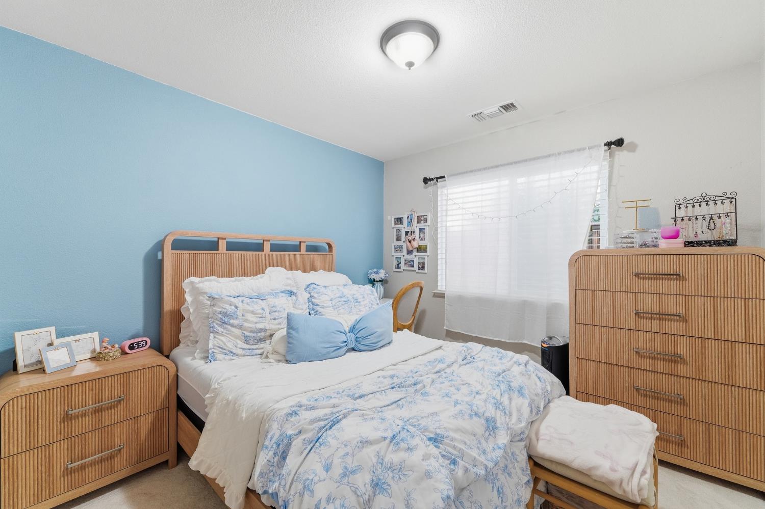 2220 Ellison Drive Modesto, CA 95355 - Photo 33 of 53 a bedroom with a bed and dresser