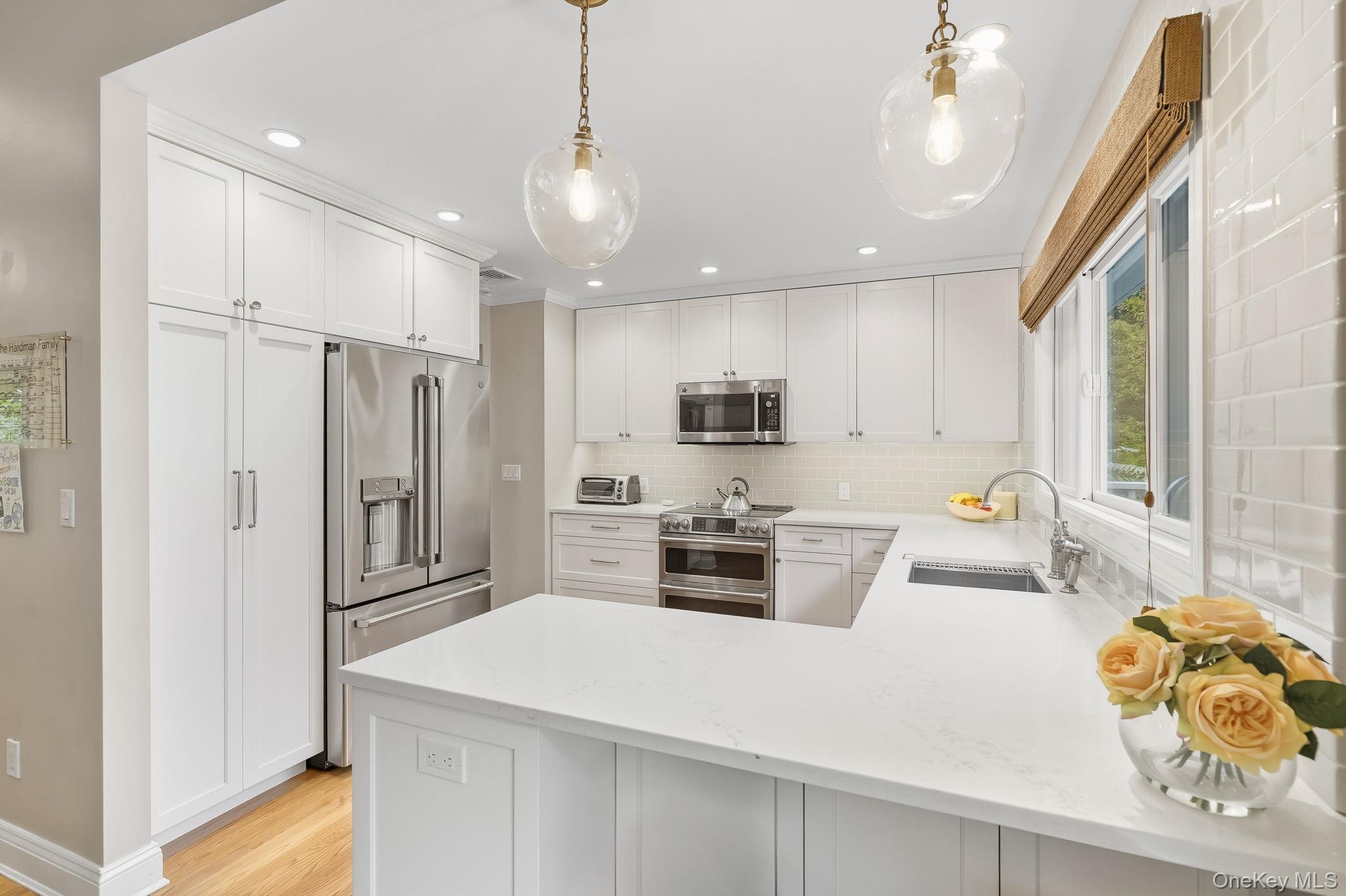 37 Tulip Road Briarcliff Manor, NY 10510 - Photo 7 of 27 a kitchen with stainless steel appliances a refrigerator sink and microwave