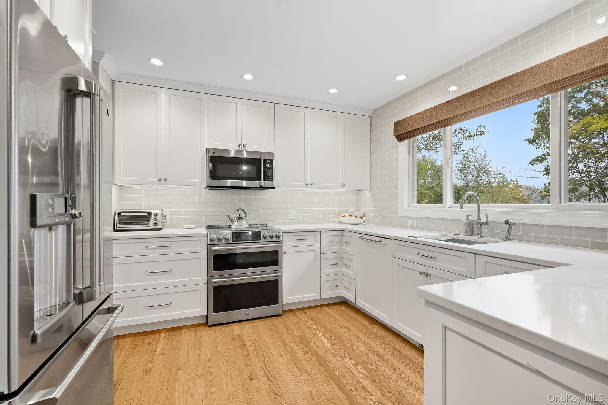 37 Tulip Road Briarcliff Manor, NY 10510 - Photo 8 of 27 a kitchen with a sink stove and refrigerator
