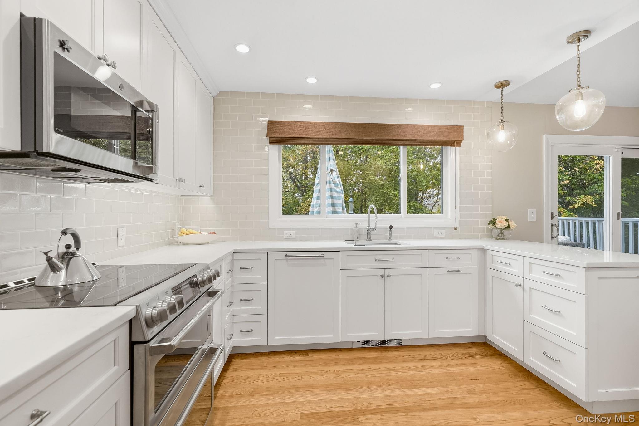 37 Tulip Road Briarcliff Manor, NY 10510 - Photo 9 of 27 a large kitchen with a sink and large window