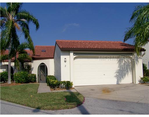 3830 Bal Harbor Boulevard, Unit 2 Punta Gorda, FL 33950 - Photo 1 of 1 Exterior Front - Hard-to-find 2 car garage has full screen door!
