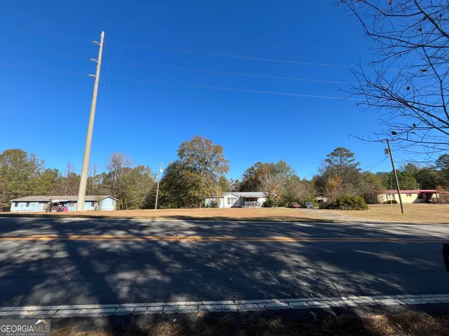 a view of a road with a building in the background