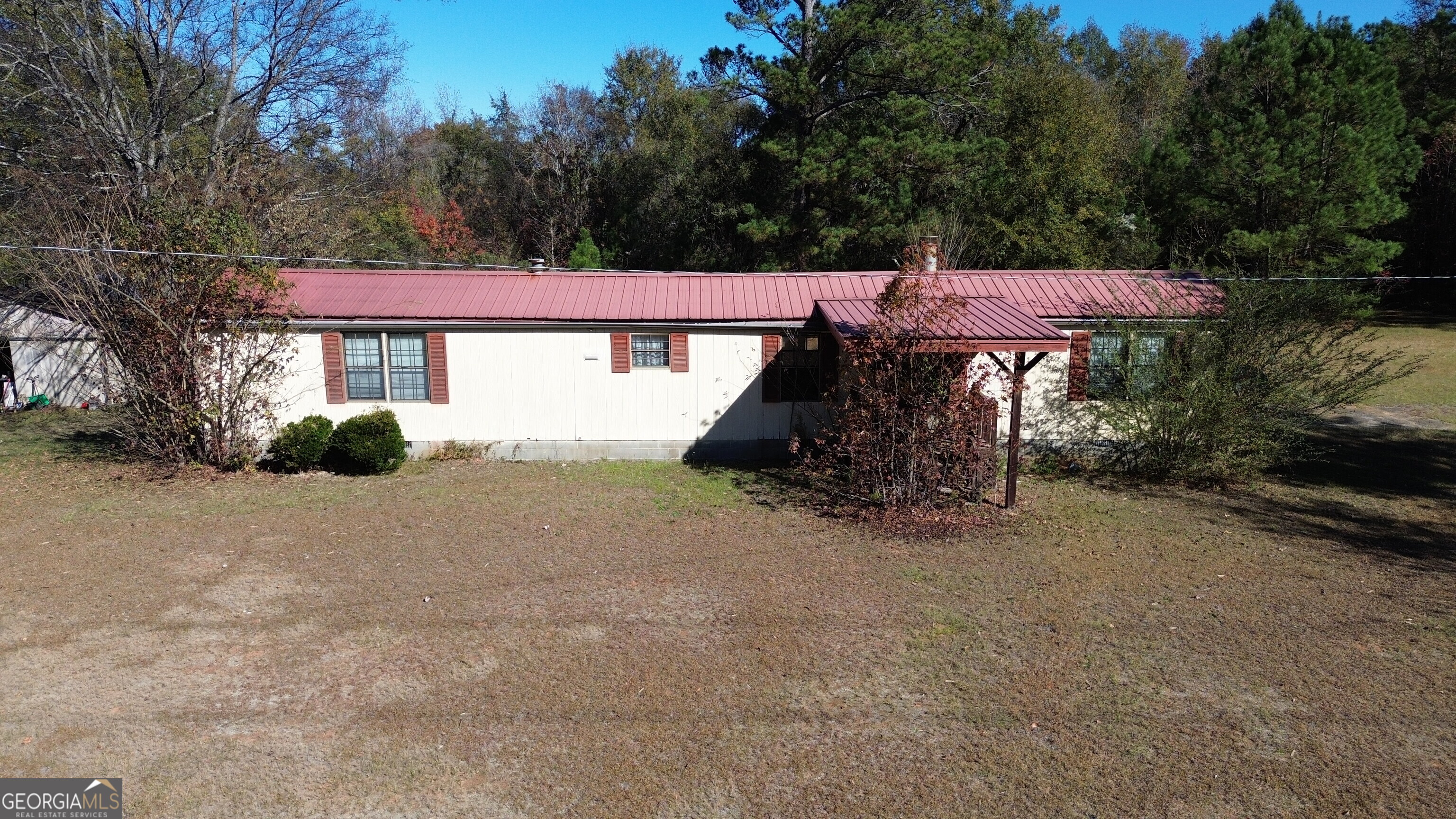 6330 Riggins Mill Road Dry Branch, GA 31020 - Photo 103 of 108 a view of a house with a yard and a bike
