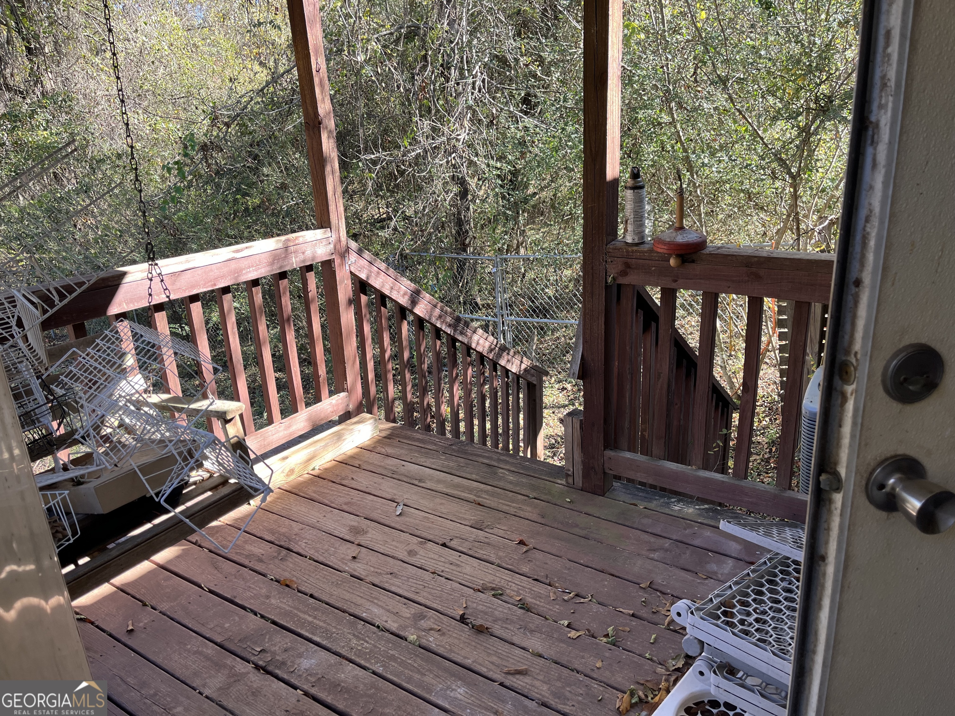 6330 Riggins Mill Road Dry Branch, GA 31020 - Photo 33 of 108 a view of deck with wooden floor and outdoor seating