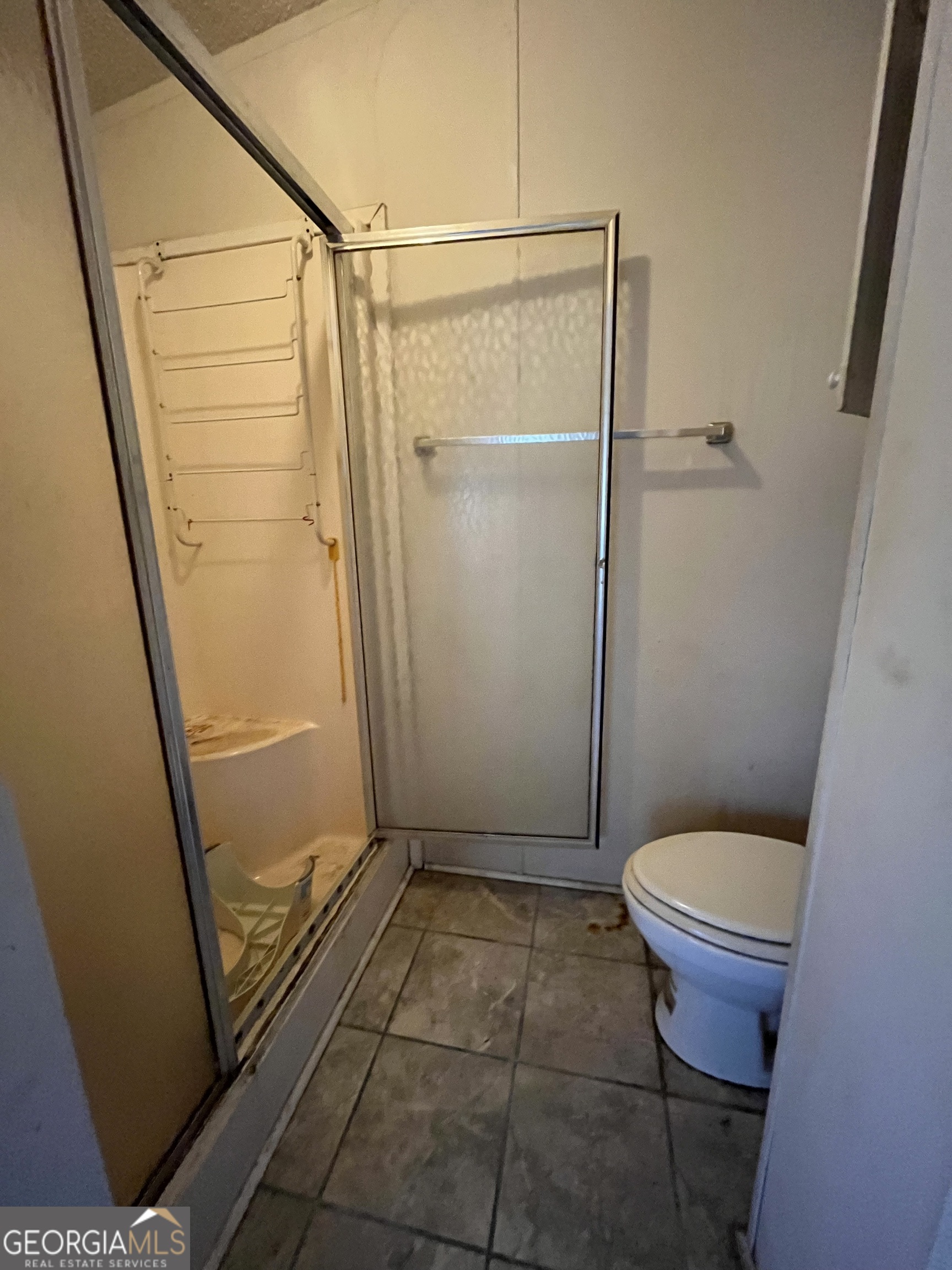 6330 Riggins Mill Road Dry Branch, GA 31020 - Photo 45 of 108 a bathroom with a toilet and a shower