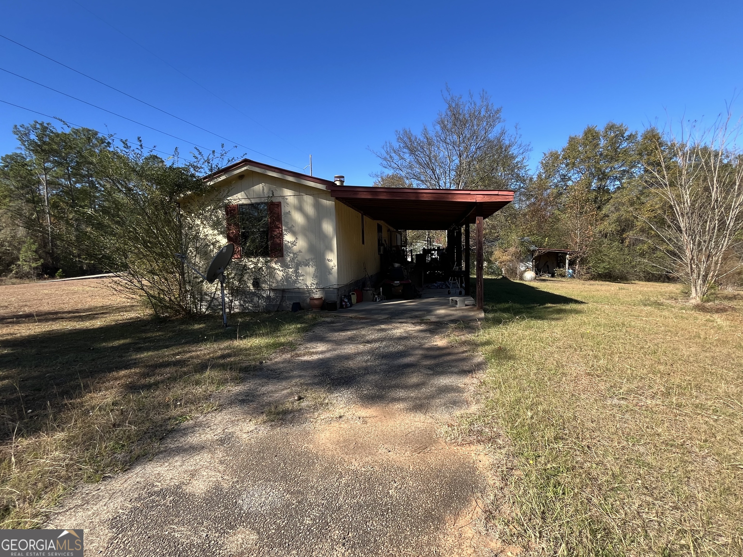 6330 Riggins Mill Road Dry Branch, GA 31020 - Photo 5 of 108 a view of a house with a yard