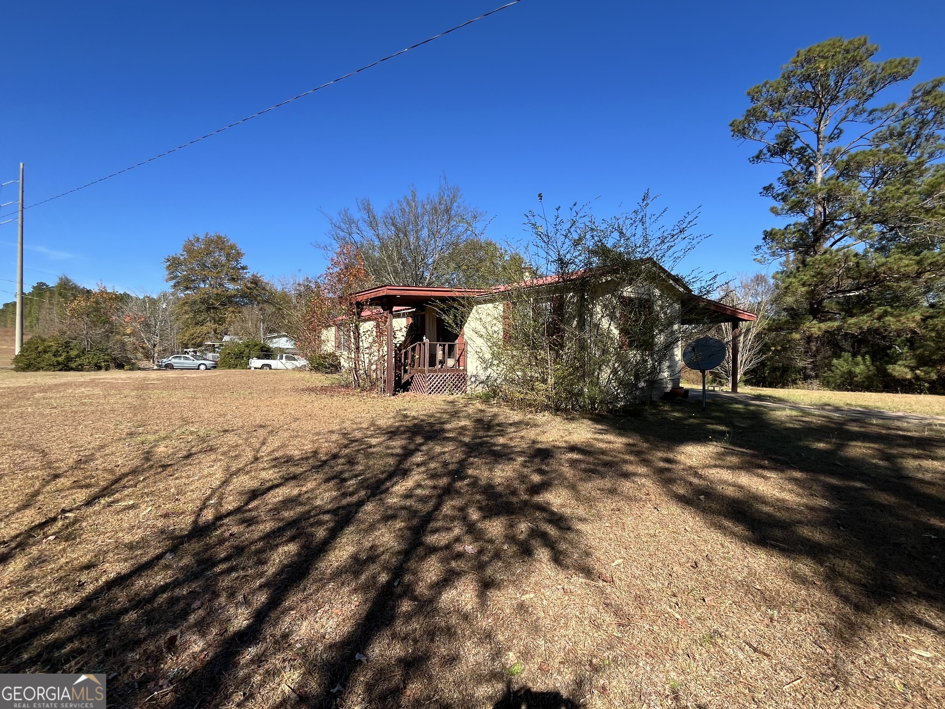 6330 Riggins Mill Road Dry Branch, GA 31020 - Photo 6 of 108 a view of a yard with a tree