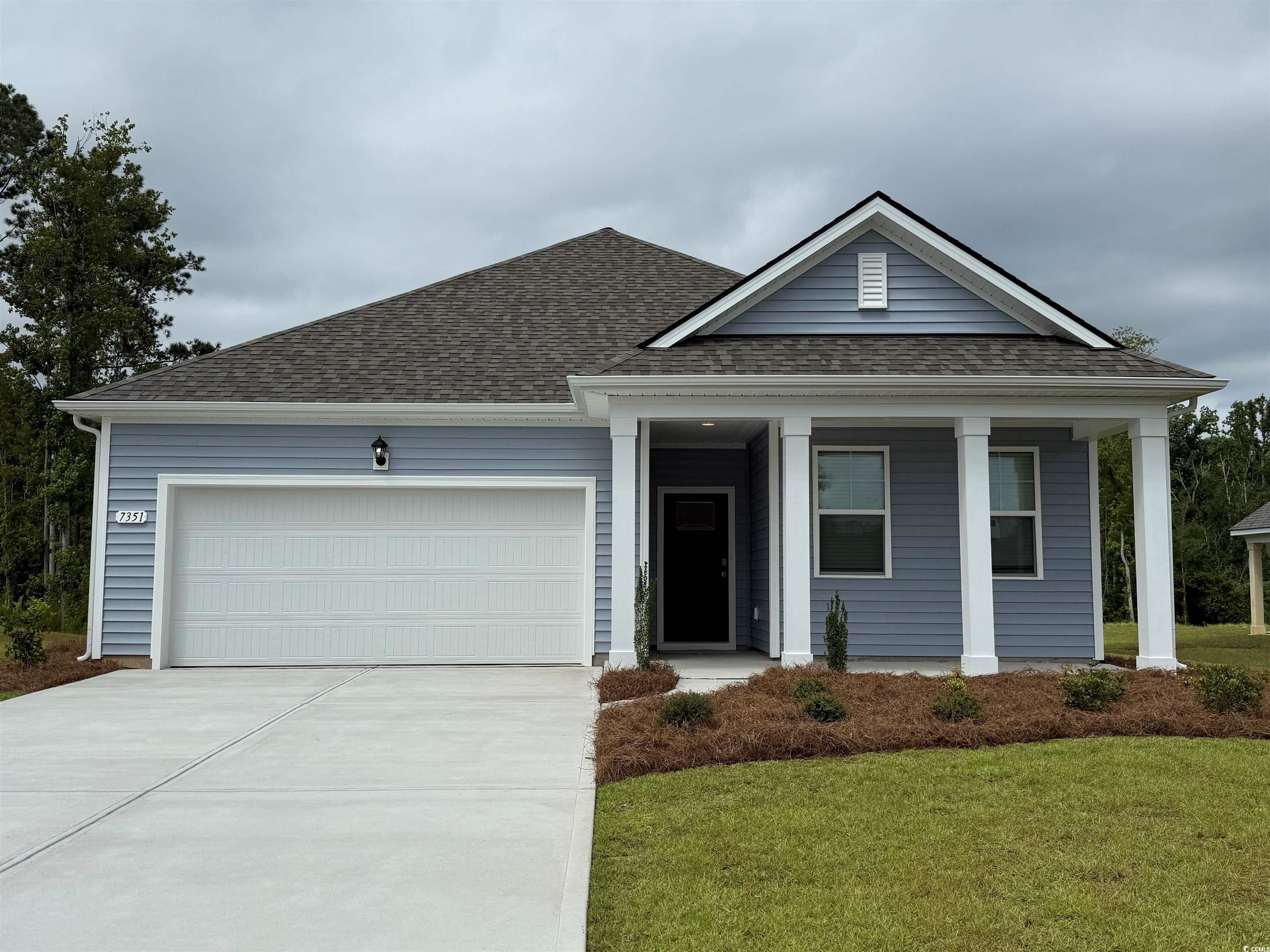 7351 Meadow Walk Loop Loris, SC 29569 - Photo 1 of 14 View of front facade featuring a front yard, an at