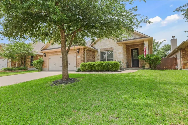 a front view of house with yard and green space