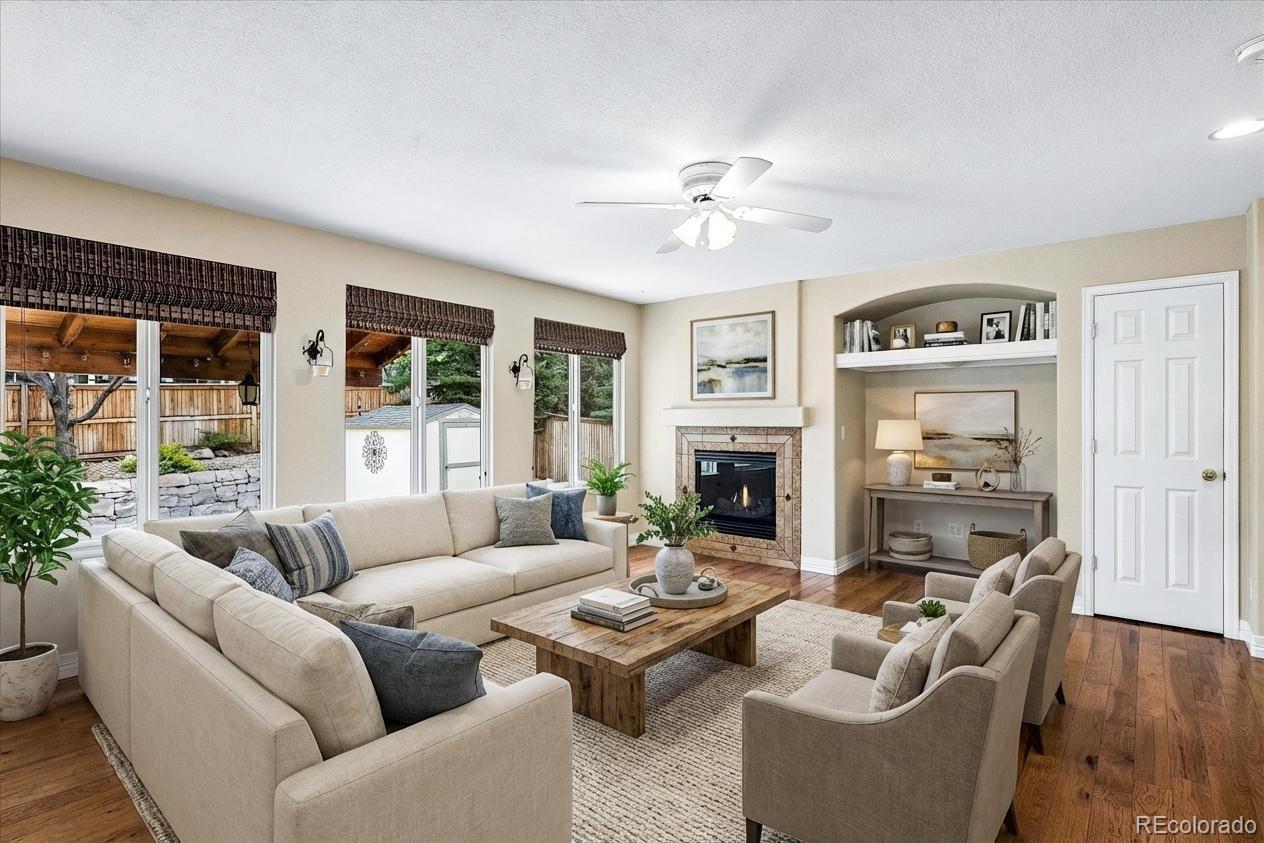 6299 Shannon Trail Highlands Ranch, CO 80130 - Photo 11 of 40 a living room with fireplace furniture and a wooden floor