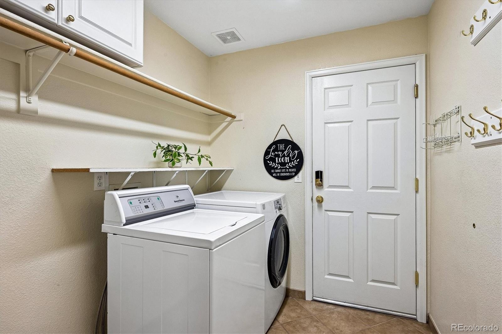 6299 Shannon Trail Highlands Ranch, CO 80130 - Photo 14 of 40 a utility room with dryer and washer