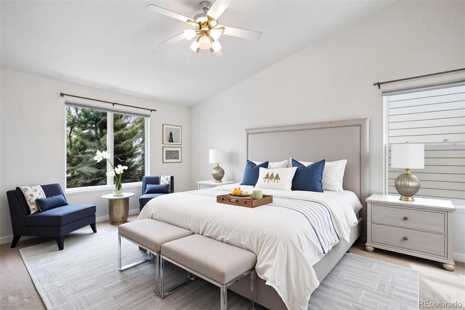 6299 Shannon Trail Highlands Ranch, CO 80130 - Photo 16 of 40 a bedroom with a bed a couches and a large window