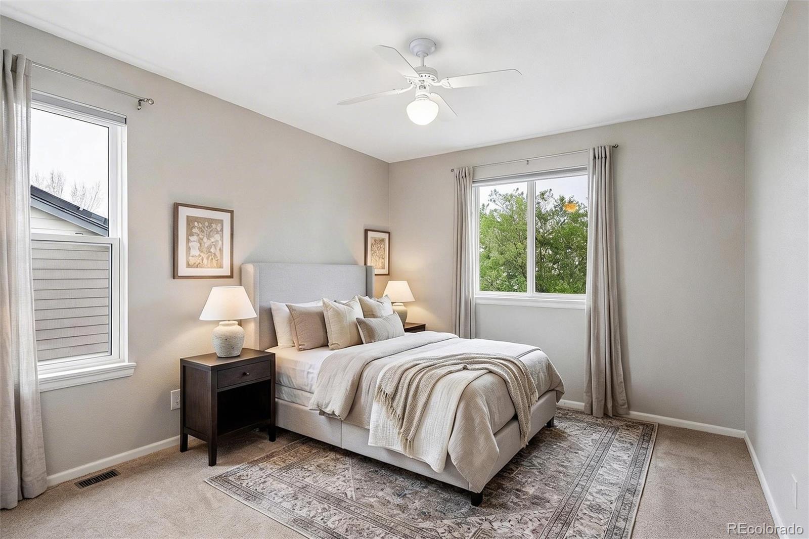 6299 Shannon Trail Highlands Ranch, CO 80130 - Photo 25 of 40 a bedroom with a large bed and a window