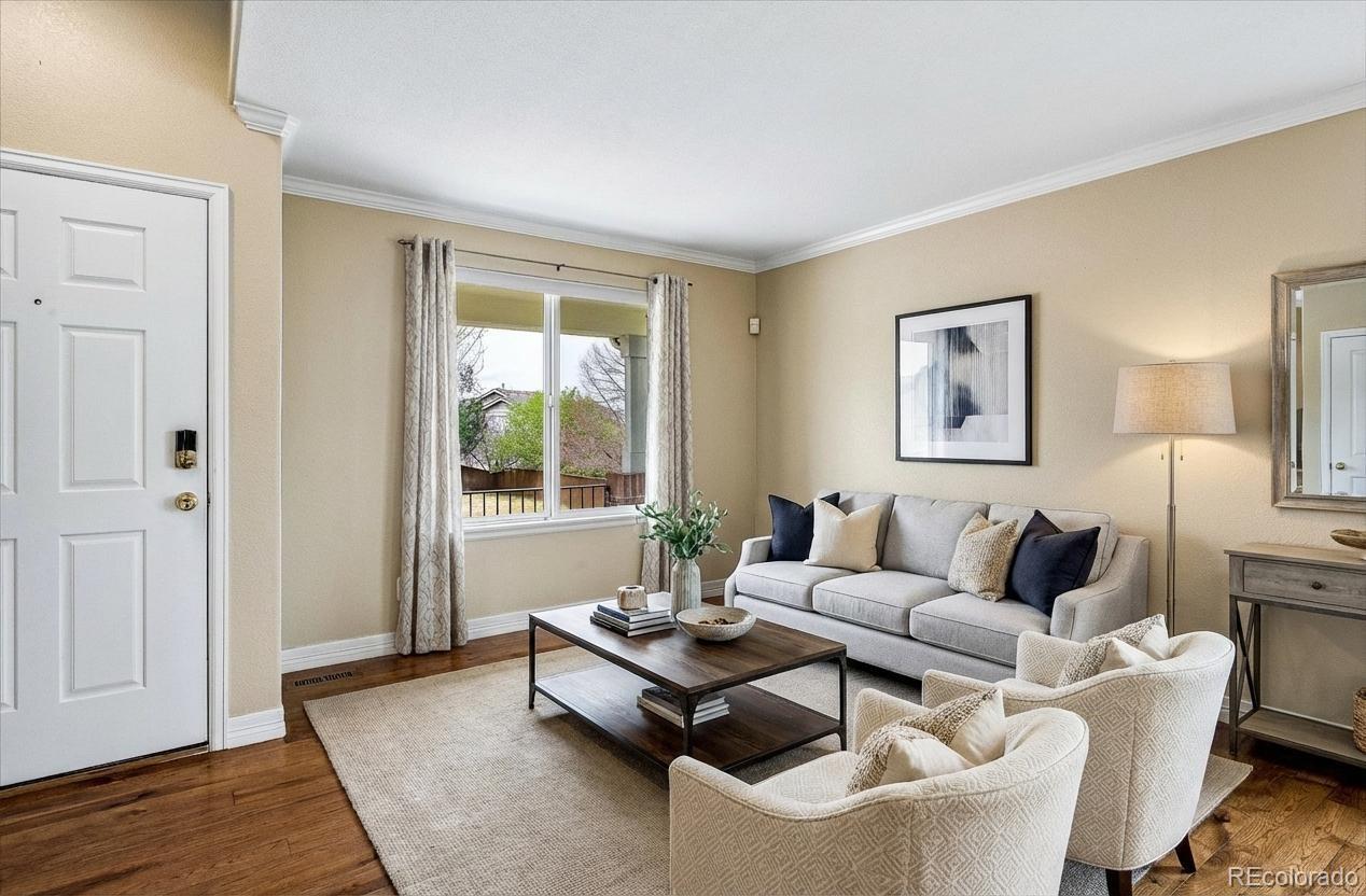 6299 Shannon Trail Highlands Ranch, CO 80130 - Photo 3 of 40 a living room with furniture and a window
