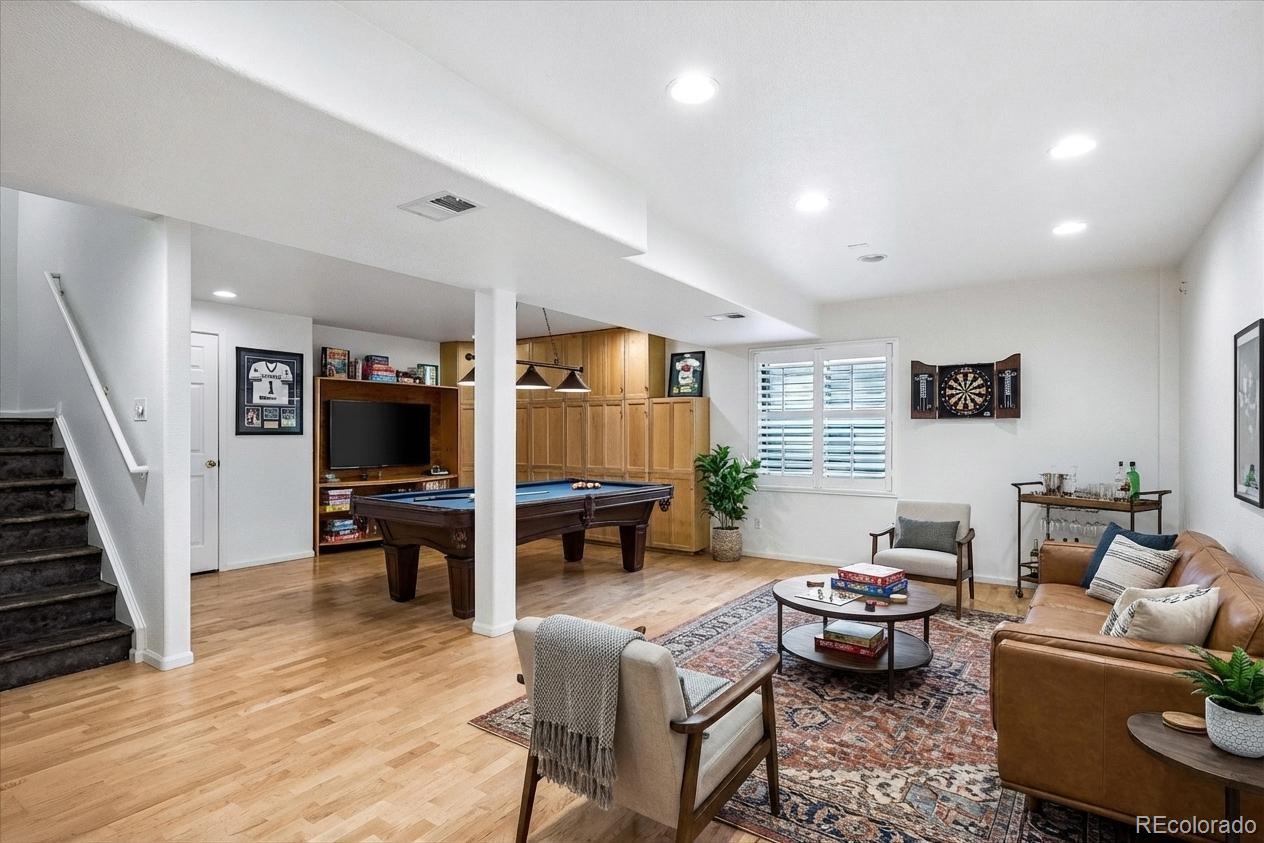 6299 Shannon Trail Highlands Ranch, CO 80130 - Photo 32 of 40 a living room with furniture and a flat screen tv