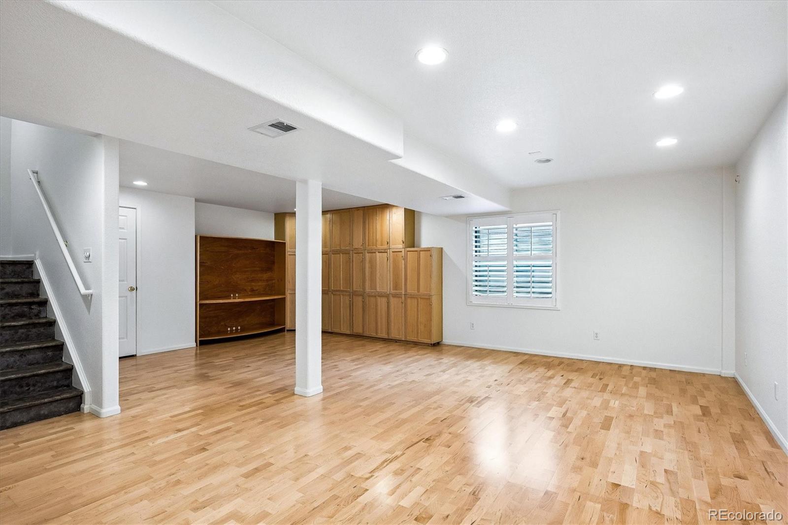 6299 Shannon Trail Highlands Ranch, CO 80130 - Photo 33 of 40 wooden floor in an empty room with a window