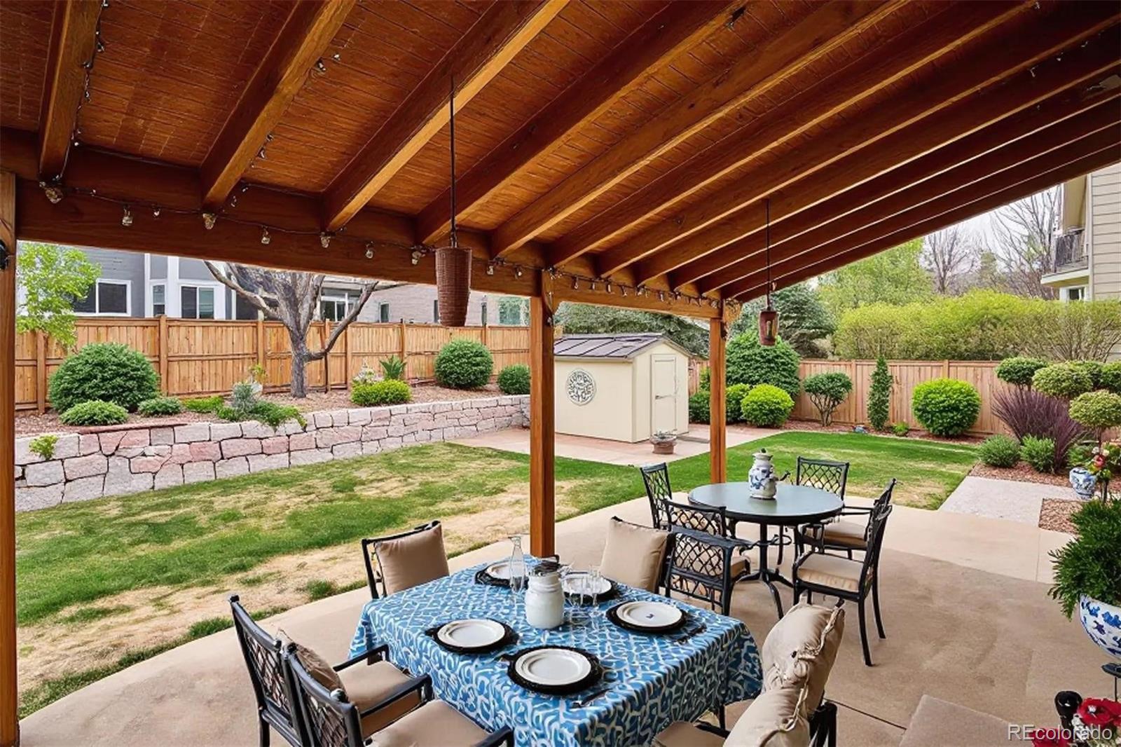 6299 Shannon Trail Highlands Ranch, CO 80130 - Photo 35 of 40 a view of an outdoor dining space with a table and chairs